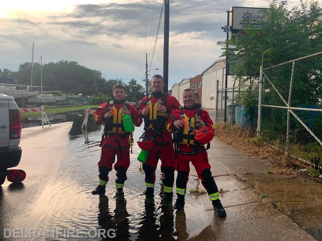 Assisting residents out of flooded Cars during large storm